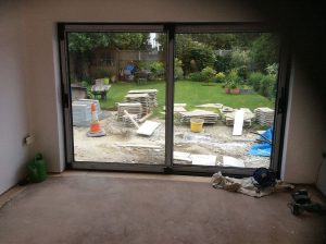 interior of property with view of garden before home extension is complete